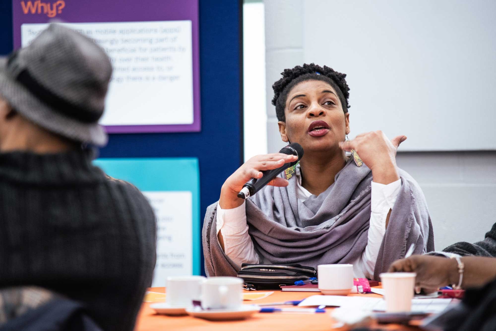 Woman talking on a microphone